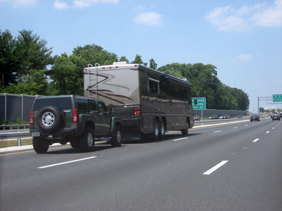 rv-motorhome-towing-hummer-by-vees.jpg