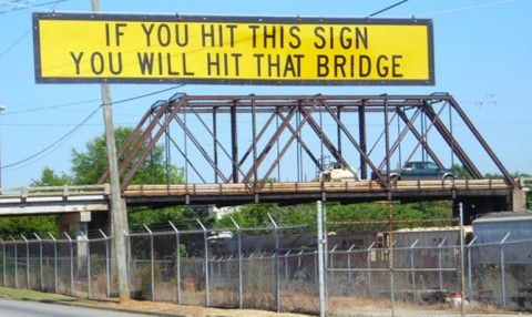 Sign before bridge: 'If you hit this sign, you’ll hit that bridge.' 