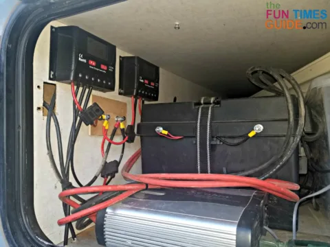 Two charge controllers and battery bank in the side compartment