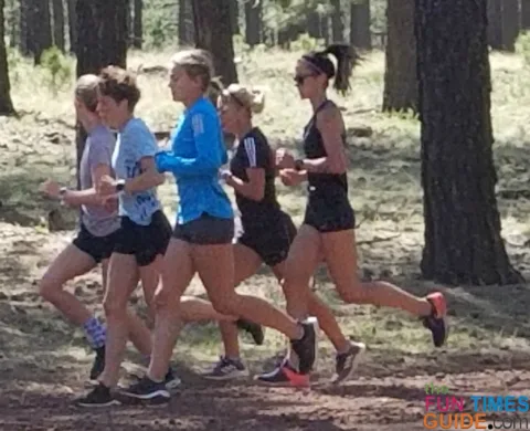 The local college girls cross country team running on Forest Roads