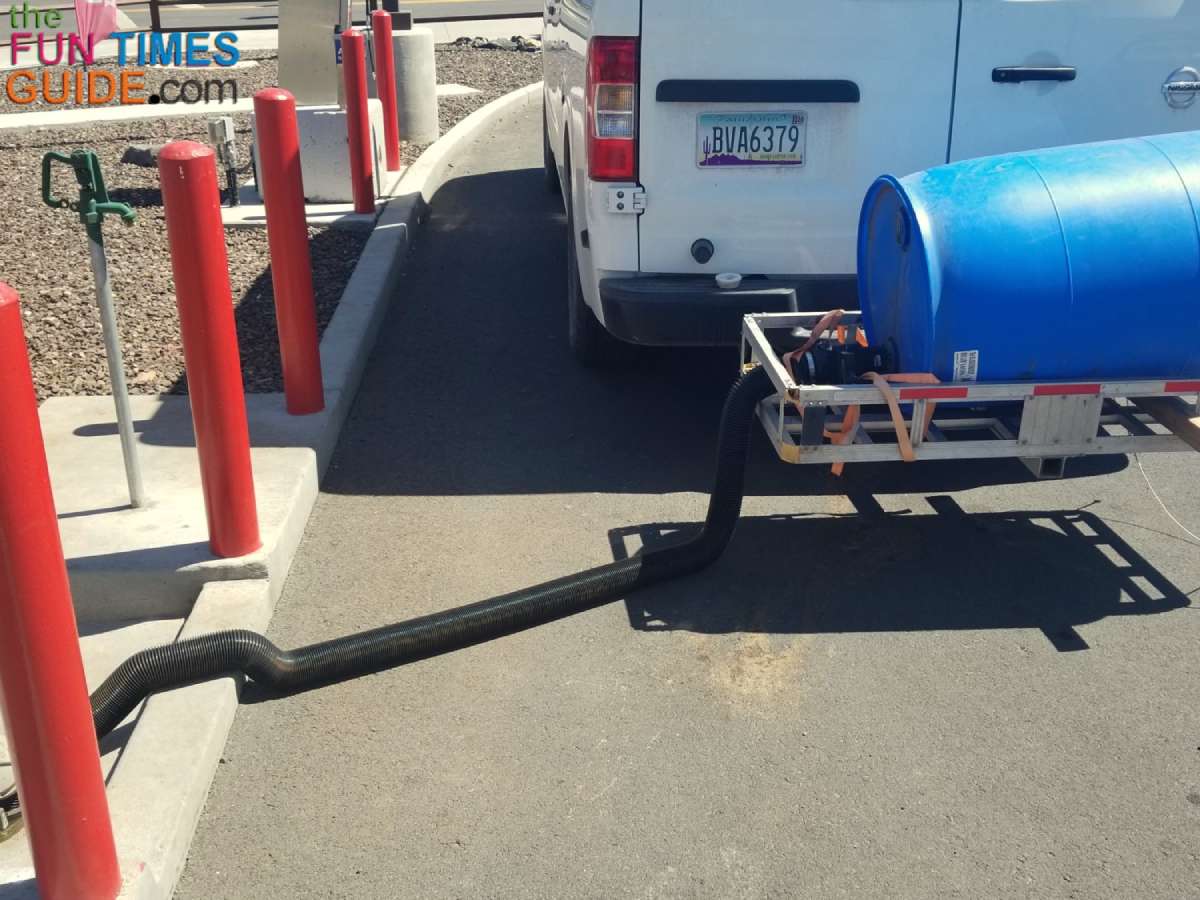 Here I'm emptying my RV portable water tank at a local gas station. 