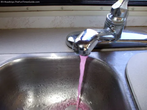 You will see pink RV antifreeze coming through the RV water faucets during when winterizing your RV. 