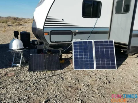 a 100-watt SV Solar Suitcase next to a homemade 200-watt suitcase