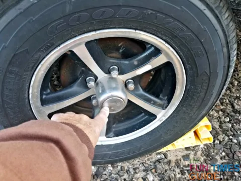 Showing where the RV wheel grease port is.